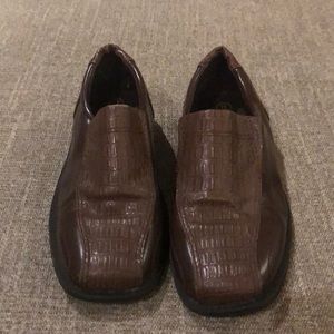 Patten brown leather shoes.
